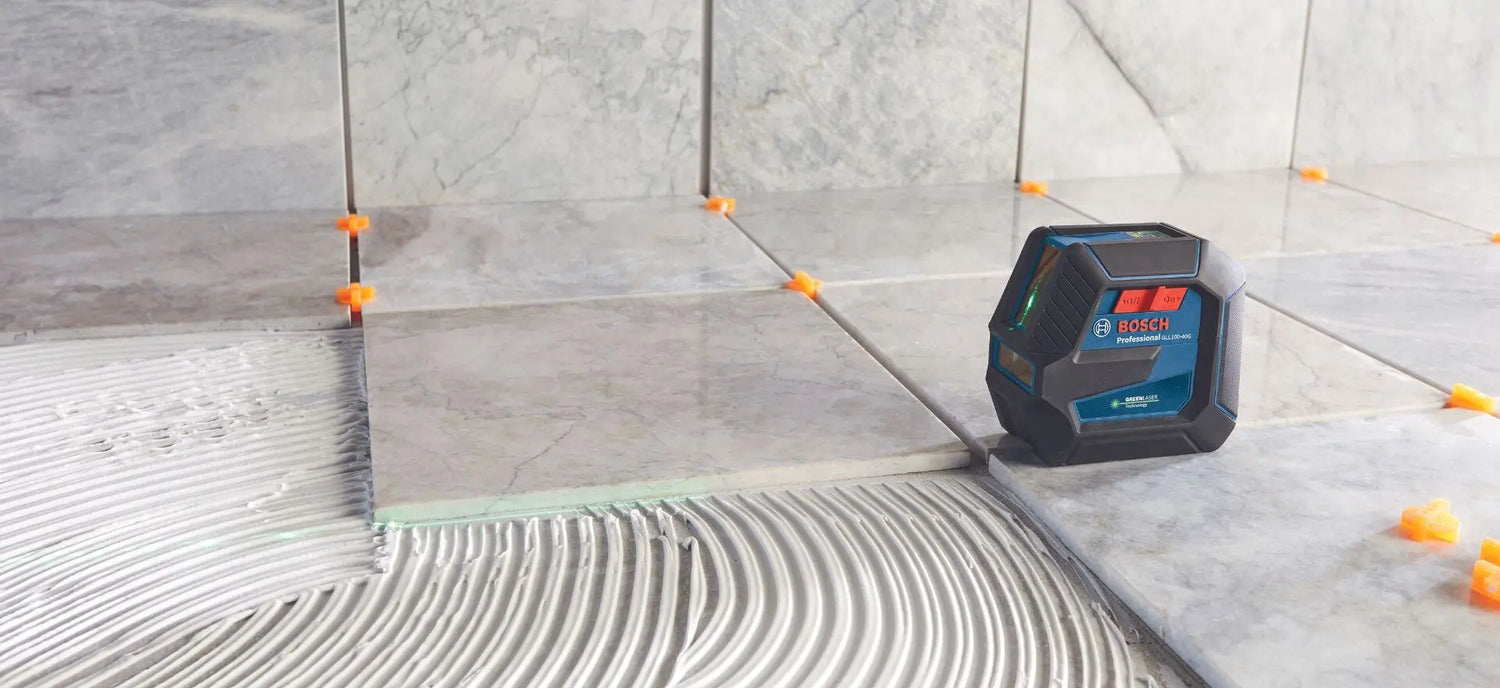 Bosch line laser in use on tiles