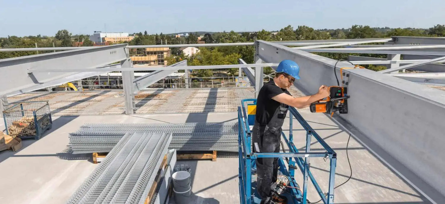 fein magnetic drill in use on structural steel beam