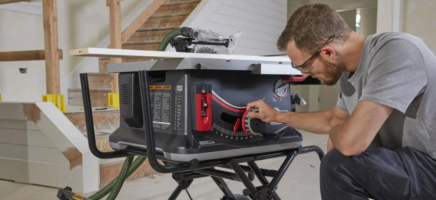 man adjusting sawstop portable table saw