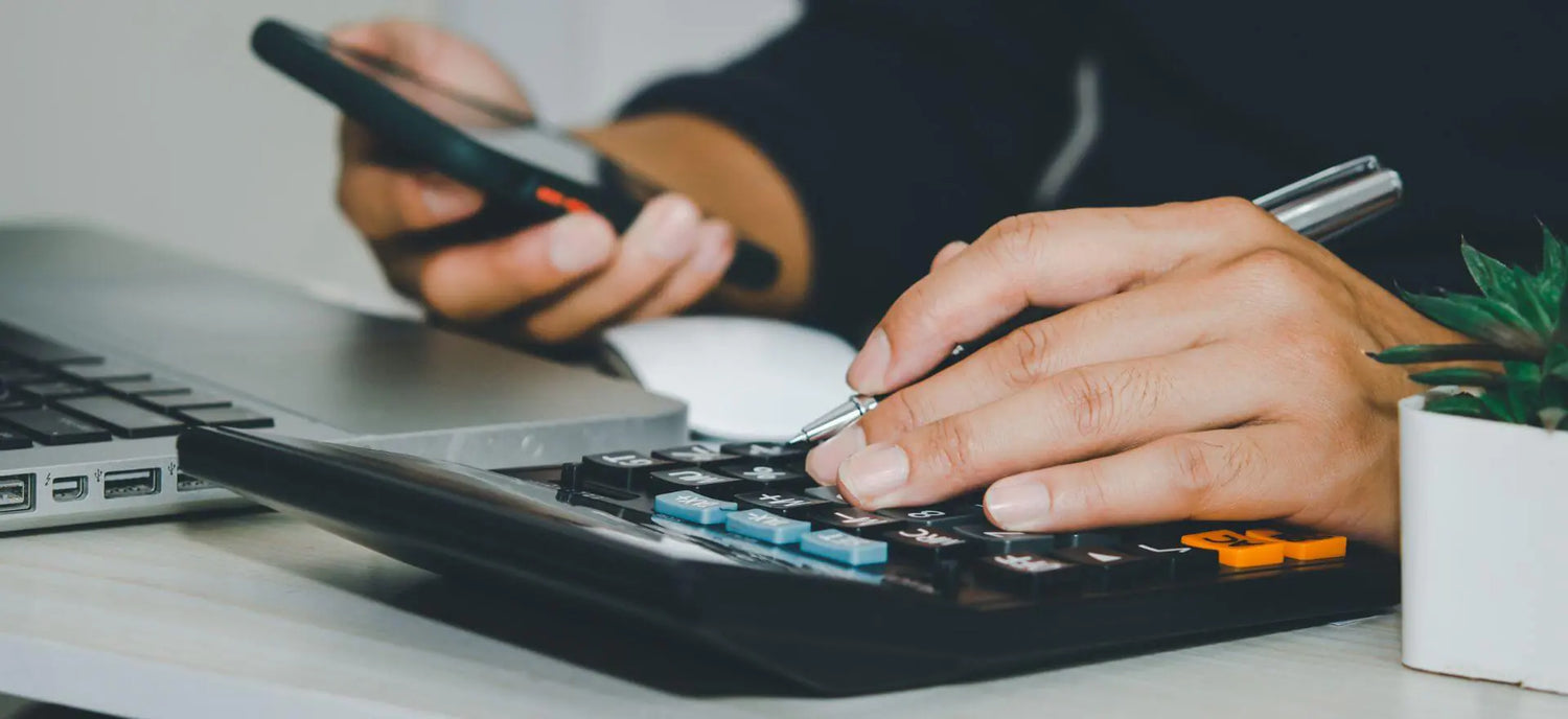 close up of a person using a calculator 