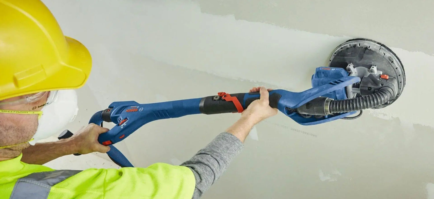 man using Bosch Drywall Sander