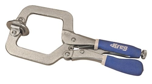 Metal locking pliers with blue cushioned handles for clamping tasks