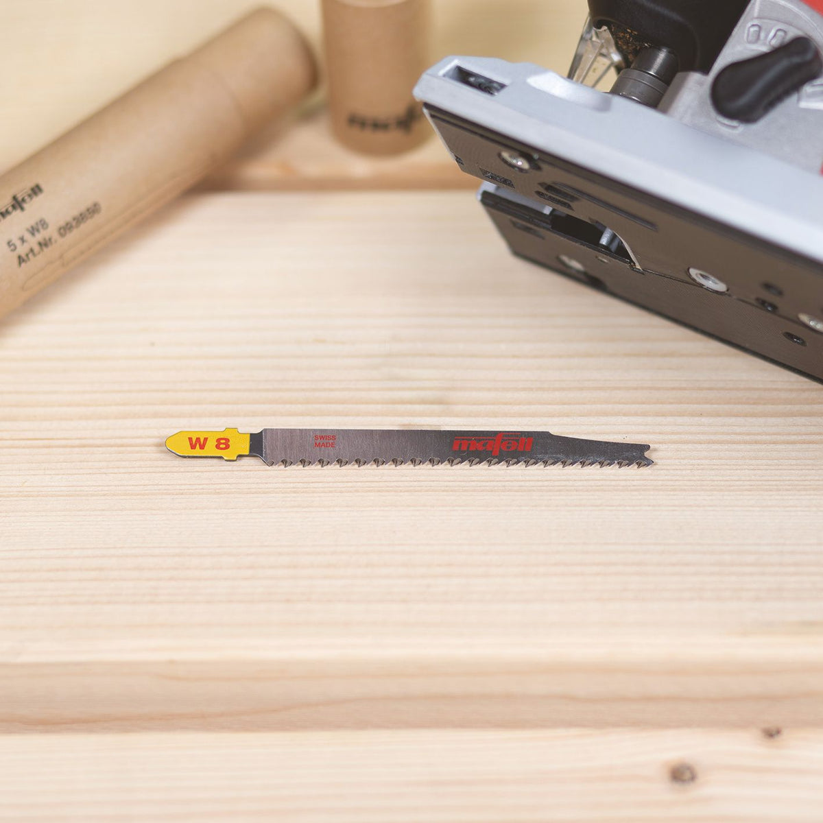 Mafell W8 wood complete jigsaw blade 95 mm length on a wooden bench with a Mafell tool visible in the background