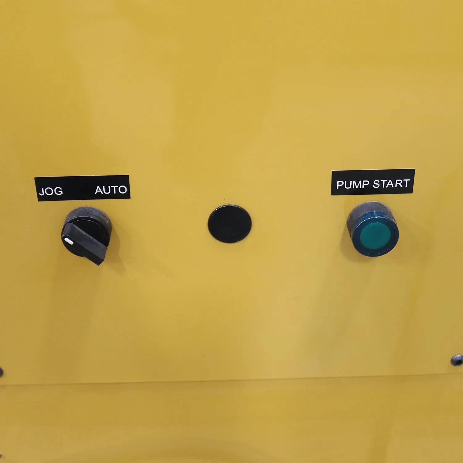 Close-up of Baileigh HPB-20 control panel with JOG AUTO switch and PUMP START button