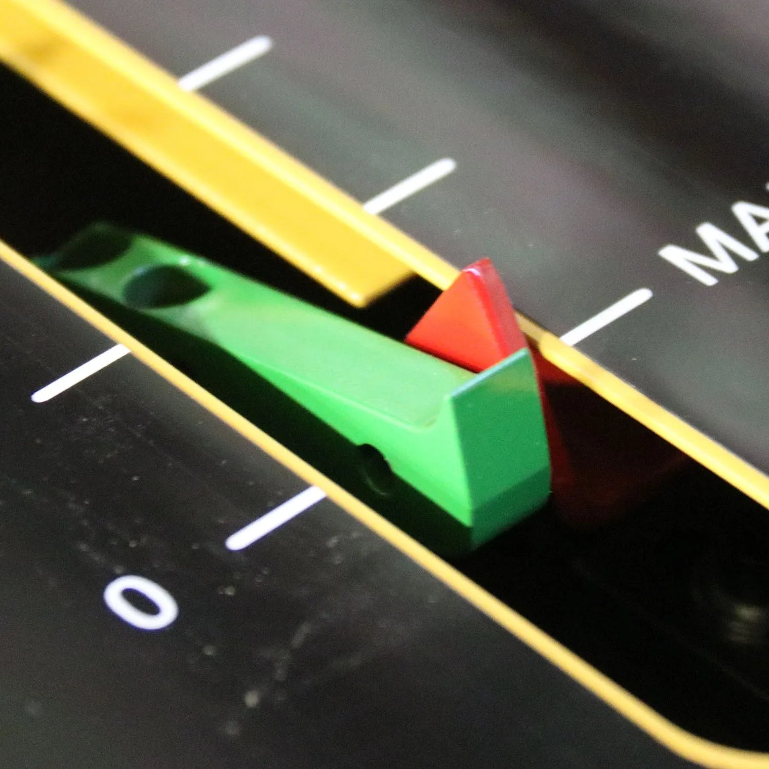 Close-up of green and red stop blocks on the scale rail of the HPB-20 bending press