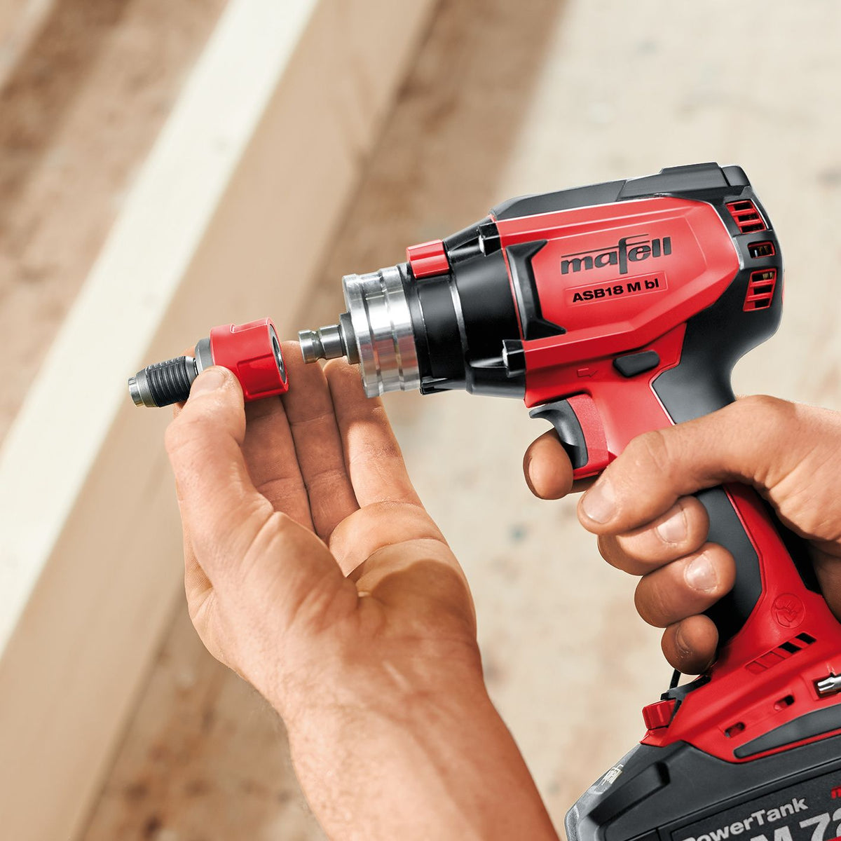 Mafell A-SBH quick release bit holder installed on a red cordless drill