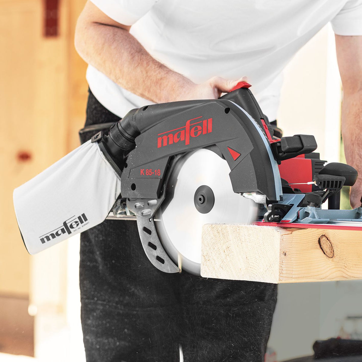 Mafell dust bag attached to a track or circular saw for onboard dust collection.