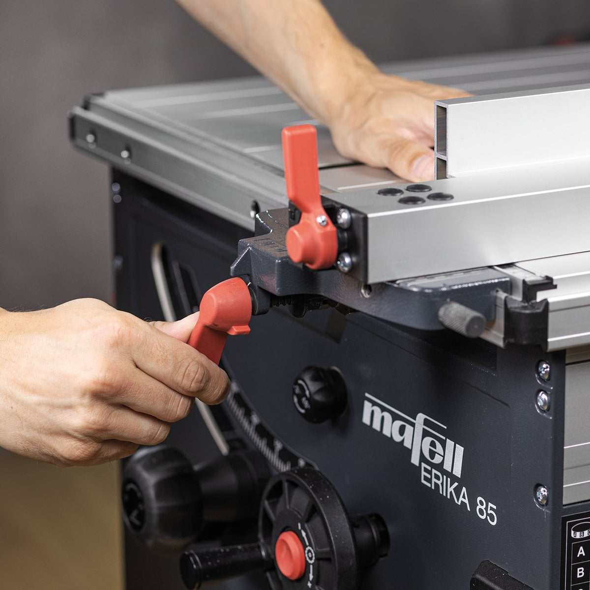 Close up of Mafell parallel guide fence with red micro adjustment lever on the ERIKA 85 saw