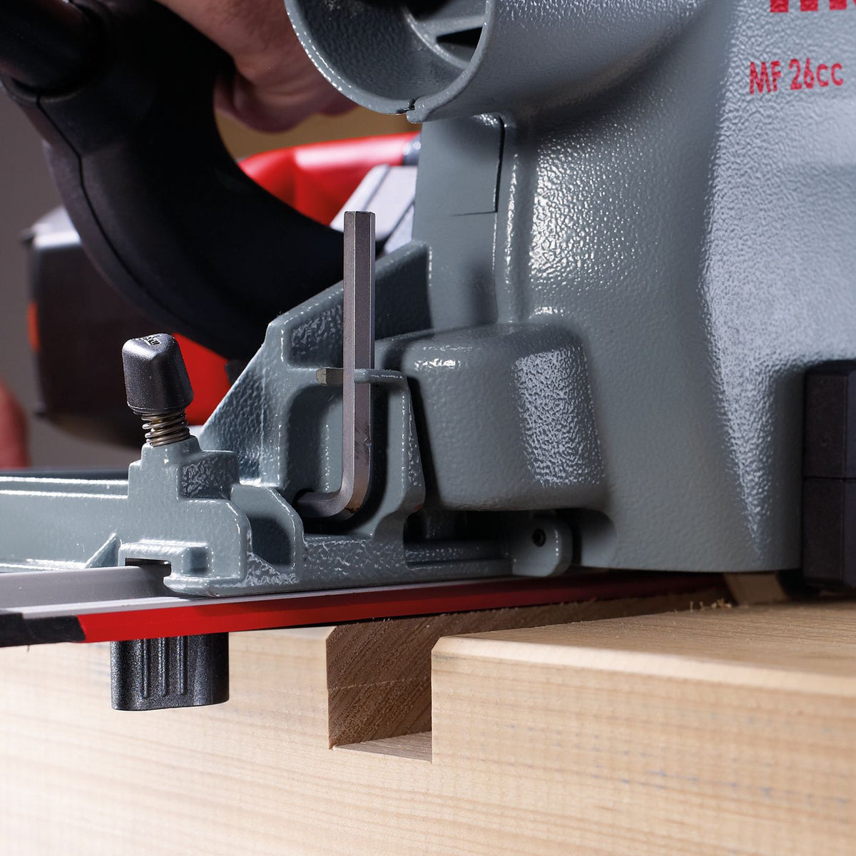 Close up of Mafell Guide Track M 400 mm cross cut guide attached to a workbench