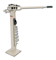 Baileigh MCB-650 Compact Flat Bar Bender with long handle and seven die sets mounted on a vertical column.