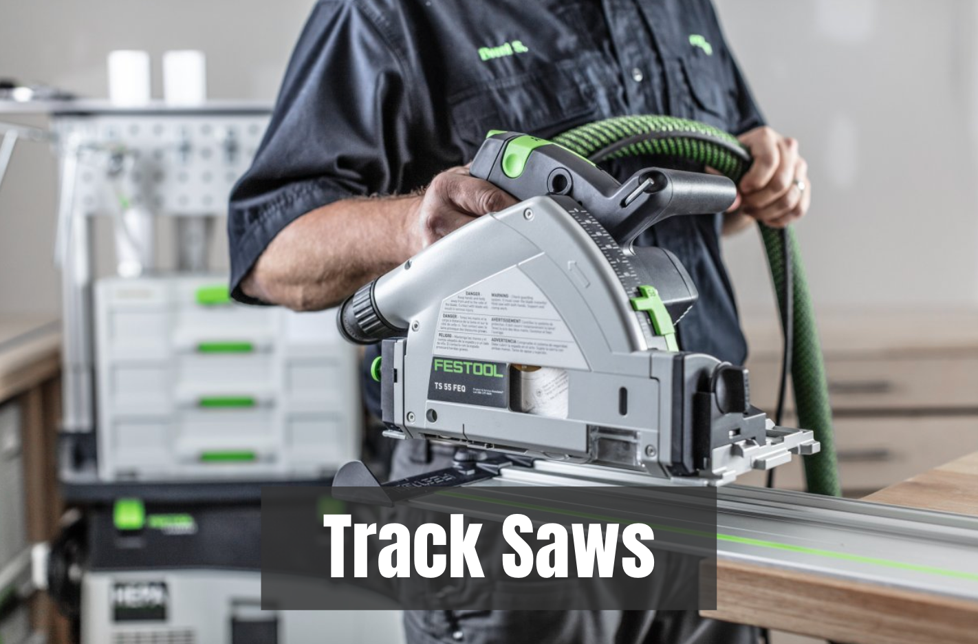 Person holding a Festool track saw in a workshop setting