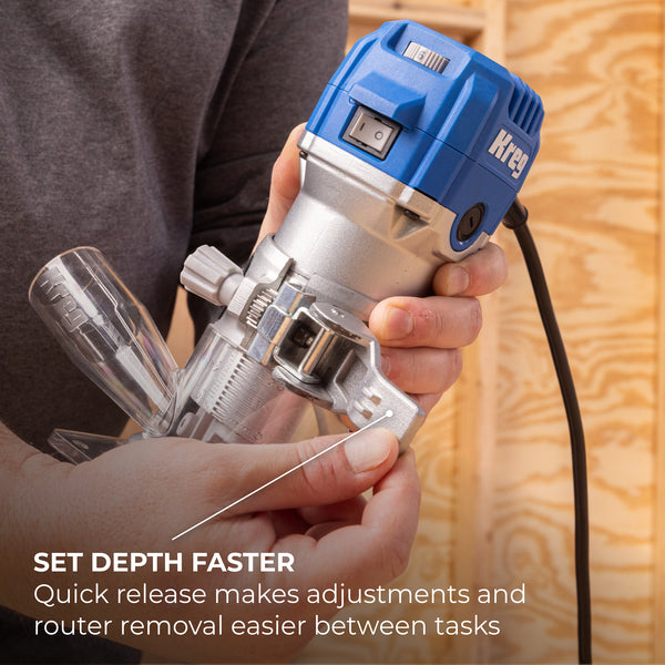 Person holding Kreg trim router with depth adjustment lever and quick-release base