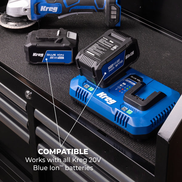 Kreg 20V Blue Ion dual fast charger with two batteries and a drill on a workbench, showing compatibility with all Blue Ion 20V batteries.