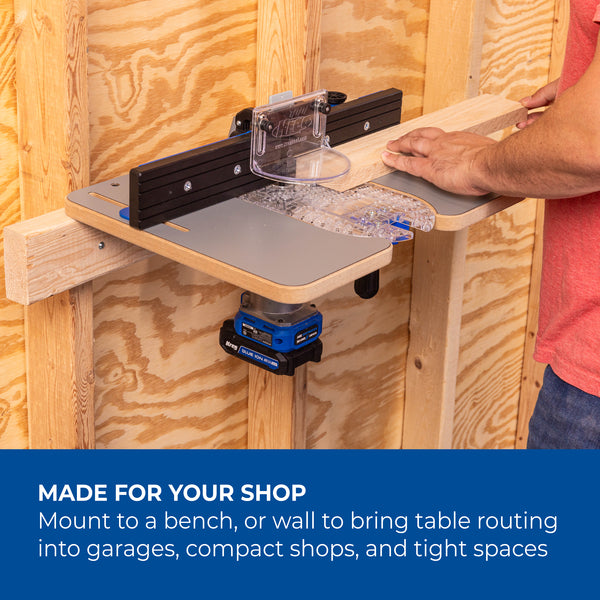 Hands guide a wooden piece along the fence on a bench mounted Kreg Dock & Go router table top for edge routing.
