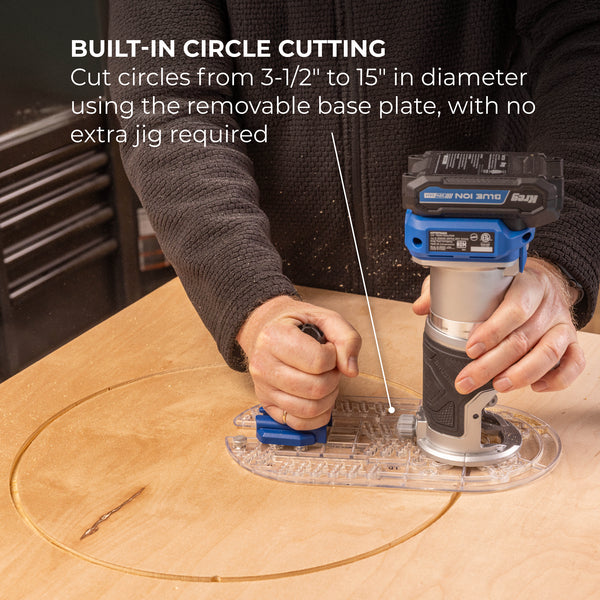 Hands operate a handheld trim router over a circular plywood workpiece for curved edge cuts.