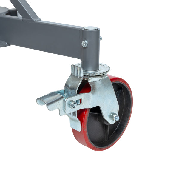 Close-up of a caster wheel with braking lever on a gray pipe jack stand